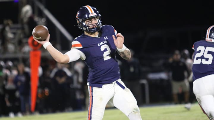 Nashville Christian quarterback Jared Curtis (2) drops his arm angle down to make a pass around Fayetteville defenders during the first quarter of their TSSAA football game Friday, Oct. 18, 2024 at Nashville Christian School in Nashville, Tennessee.