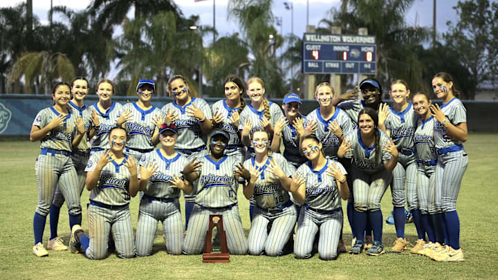 Wellington's softball squad poses for a celebratory photo after winning the district title against Jupiter on April 30, 2025.