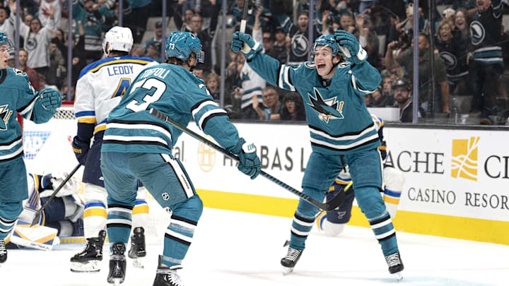 Oct 10, 2024; San Jose, California, USA; San Jose Sharks center Macklin Celebrini (71) reacts after center Tyler Toffoli (73) scores a goal during the first period against the St. Louis Blues at SAP Center at San Jose. Mandatory Credit: Stan Szeto-Imagn Images
