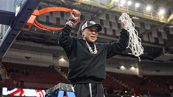 March 9, 2025; Greenville, SC, USA; South Carolina Gamecocks head coach Dawn Staley cuts the net down after the win over Texas in the SEC women’s championship at Bon Secours Wellness Arena. Mandatory Credit: Jim Dedmon-Imagn Images March 9, 2025; Greenville, SC, USA; South Carolina Gamecocks head coach Dawn Staley cuts the net down after the win over Texas in the SEC women’s championship at Bon Secours Wellness Arena. Mandatory Credit: Jim Dedmon-Imagn Images