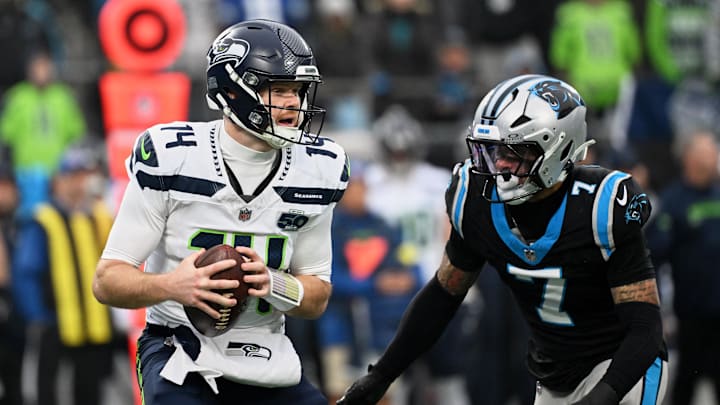 Dec 28, 2025; Charlotte, North Carolina, USA; Carolina Panthers safety Tre'von Moehrig (7) rushes against Seattle Seahawks quarterback Sam Darnold (14) during the first quarter at Bank of America Stadium. Mandatory Credit: Bob Donnan-Imagn Images