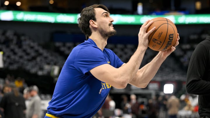 Mar 13, 2024; Dallas, Texas, USA; Golden State Warriors forward Dario Saric (20) warms up before the game between the Dallas Mavericks and the Golden State Warriors at the American Airlines Center. Mandatory Credit: Jerome Miron-USA TODAY Sports