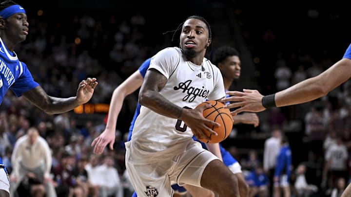 Mar 3, 2026; College Station, Texas, USA; Texas A&M Aggies guard Marcus Hill (0) drives against the Kentucky Wildcats during the second half at Reed Arena. Mandatory Credit: Maria Lysaker-Imagn Images 