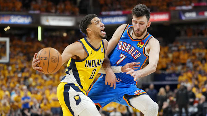 Jun 13, 2025; Indianapolis, Indiana, USA; Indiana Pacers guard Tyrese Haliburton (0) drives to the basket against Oklahoma City Thunder forward Chet Holmgren (7) during the second half during game four of the 2025 NBA Finals at Gainbridge Fieldhouse. Mandatory Credit: Kyle Terada-Imagn Images