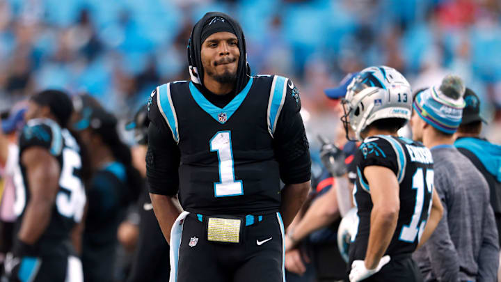 CHARLOTTE, NORTH CAROLINA - DECEMBER 26: Cam Newton #1 of the Carolina Panthers watches from the sideline during the final minute of the team's final home game of the season against the Tampa Bay Buccaneers at Bank of America Stadium on December 26, 2021 in Charlotte, North Carolina.