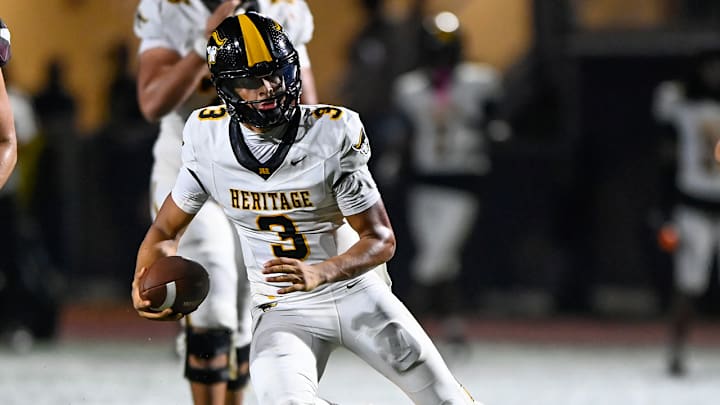 American Heritage star quarterback Dia Bell runs for yardage during a season opening win over St. Joseph Prep, on Aug. 22, 2025.