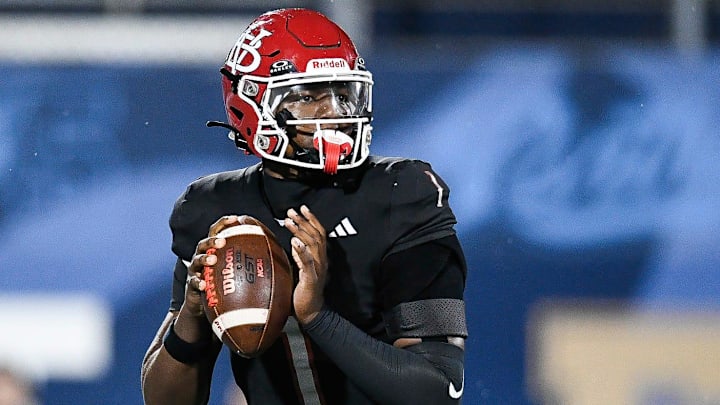 Champ Monds (1) of Vero Beach looks to pass in the FHSAA Class 7A state championship, Dec. 13, 2025, at Pitbull Stadium in Miami. Champ Monds (1) of Vero Beach looks to pass in the FHSAA Class 7A state championship, Dec. 13, 2025, at Pitbull Stadium in Miami.