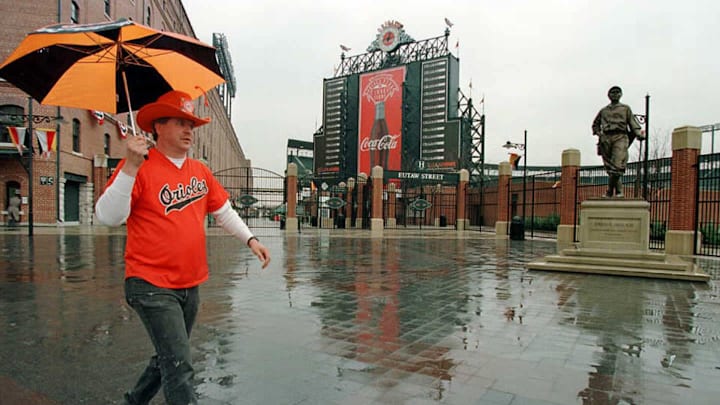 Baltimore Orioles fan Ron Kropkowski walks in the