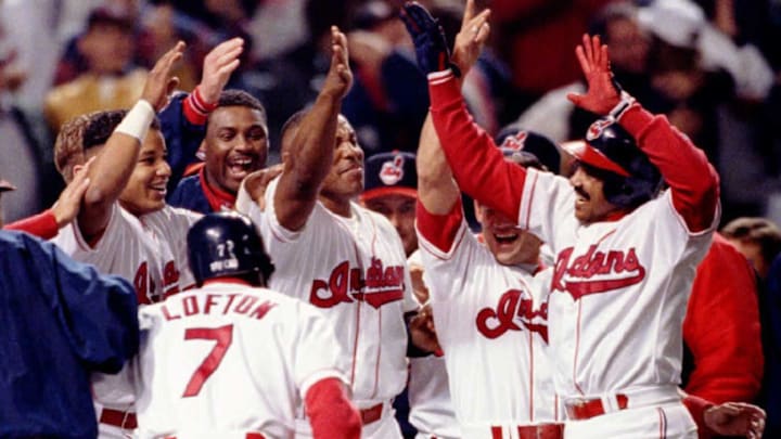 Cleveland Indians Tony Pena (R) is met by celebrat