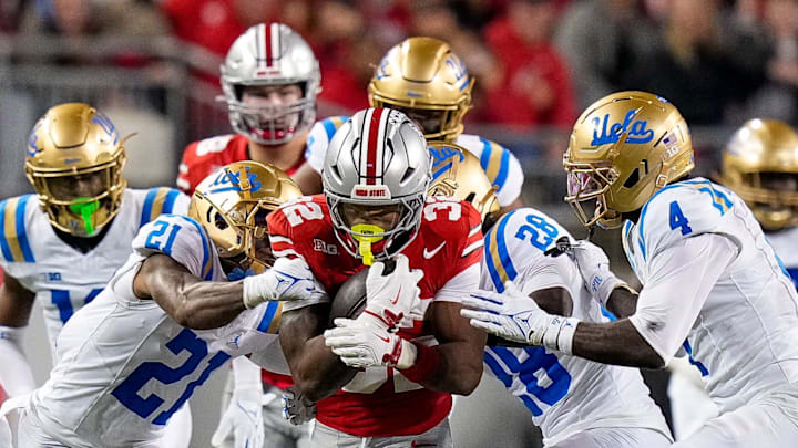 Ohio State Buckeyes running back Isaiah West (32) runs the ball against the UCLA Bruins in the first half of the NCAA college football game at Ohio Stadium on Saturday, Nov. 15, 2025 in Columbus, Ohio.