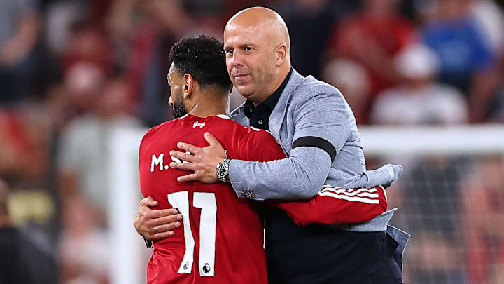 Mohamed Salah (left) has come under scrutiny for his tactical role under Arne Slot.