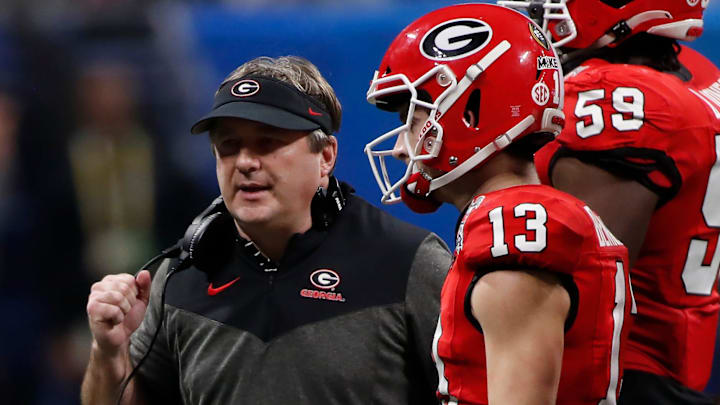 Georgia coach Kirby Smart speaks with Georgia quarterback Stetson Bennett (13) during the second half of the Chick-fil-A Peach Bowl NCAA College Football Playoff semifinal game between Ohio State and Georgia on Saturday, Dec 31, 2022, in Atlanta. Georgia won 42-41.

News Joshua L Jones