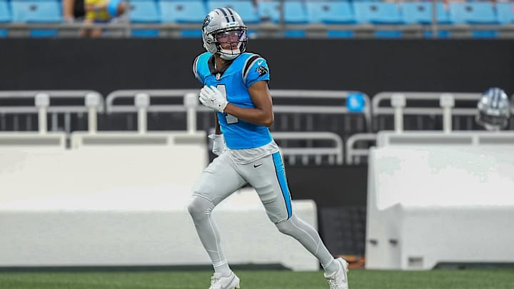 Aug 2, 2025; Charlottle, NC, USA; Carolina Panthers wide receiver Tetairoa McMillan (4) runs a pass route during Fanfest at Bank of America Stadium. Mandatory Credit: Jim Dedmon-Imagn Images