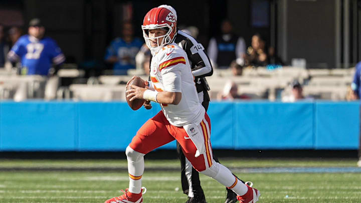 Nov 24, 2024; Charlotte, North Carolina, USA; Kansas City Chiefs quarterback Patrick Mahomes (15) runs out of the pocket during the second quarter against the Carolina Panthers at Bank of America Stadium. Mandatory Credit: Jim Dedmon-Imagn Images