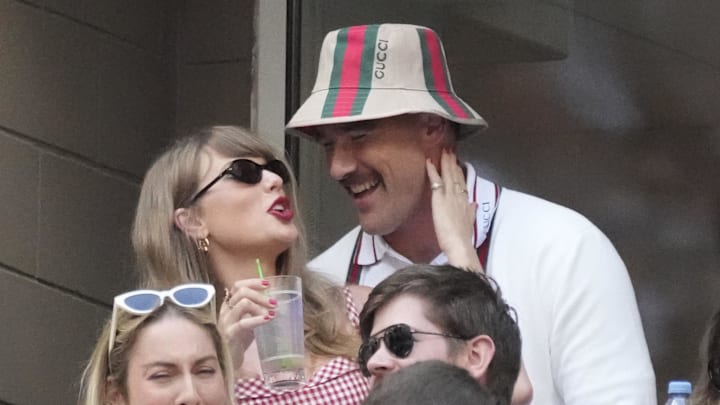 Sep 8, 2024; Flushing, NY, USA; Recording artist Taylor Swift and Kansas City Chiefs tight end Travis Kelce talk during the men’s singles final of the 2024 U.S. Open tennis tournament at USTA Billie Jean King National Tennis Center. 