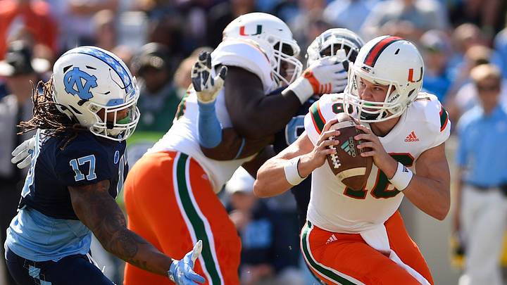 Oct 28, 2017; Chapel Hill, NC, USA; Miami Hurricanes quarterback Evan Shirreffs (16) looks to pass as North Carolina Tar Heels defensive end Dajaun Drennon (17) defends in the first quarter at Kenan Memorial Stadium. Mandatory Credit: Bob Donnan-USA TODAY Sports Oct 28, 2017; Chapel Hill, NC, USA; Miami Hurricanes quarterback Evan Shirreffs (16) looks to pass as North Carolina Tar Heels defensive end Dajaun Drennon (17) defends in the first quarter at Kenan Memorial Stadium. Mandatory Credit: Bob Donnan-USA TODAY Sports