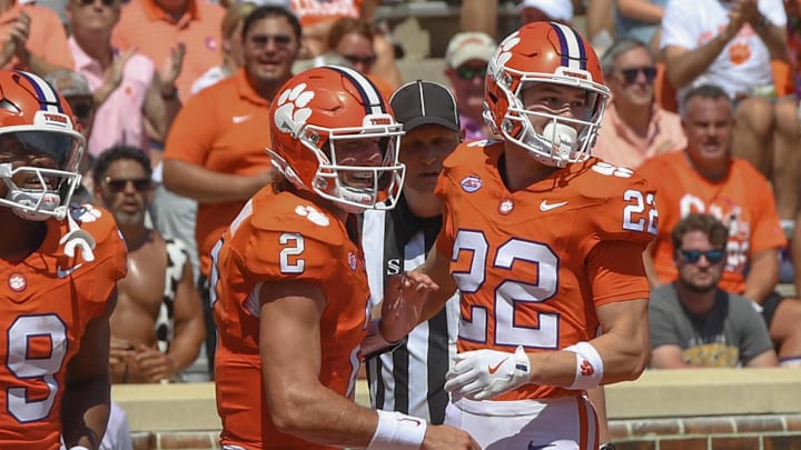 Sep 21, 2024; Clemson, South Carolina, USA; Clemson Tigers wide receiver Cole Turner (22) celebrates with quarterback Cade Klubnik (2) after scoring a touchdown against the North Carolina State Wolfpack during the second quarter at Memorial Stadium.