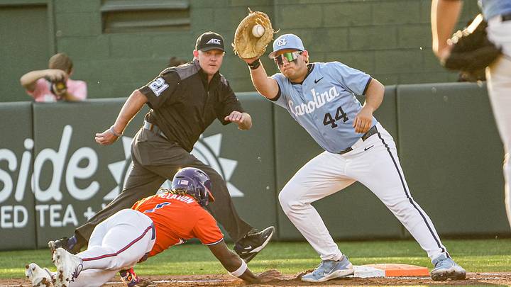 Clemson outfielder Bryce Clavon (1) dives back to first under the tag of University of North Carolina junior Erik Paulsen (44) during the bottom of the third inning at Doug Kingsmore Stadium in Clemson, S.C. Friday, April 10, 2026. Clemson outfielder Bryce Clavon (1) dives back to first under the tag of University of North Carolina junior Erik Paulsen (44) during the bottom of the third inning at Doug Kingsmore Stadium in Clemson, S.C. Friday, April 10, 2026.