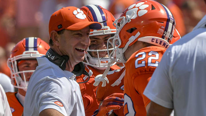 Sep 21, 2024; Clemson, South Carolina, USA; Clemson Tigers wide receiver Cole Turner (22) celebrates with head coach Dabo Swinney after scoring a touchdown against the North Carolina State Wolfpack during the second quarter at Memorial Stadium. 