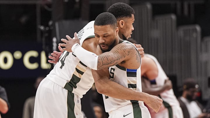Mar 4, 2025; Atlanta, Georgia, USA; Milwaukee Bucks forward Giannis Antetokounmpo (34) and guard Damian Lillard (0) react after defeating the Atlanta Hawks at State Farm Arena. Mandatory Credit: Dale Zanine-Imagn Images