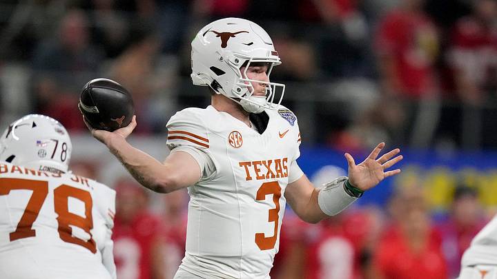 Texas Longhorns quarterback Quinn Ewers throws the ball against the Ohio State Buckeyes defense in the first quarter of the Cotton Bowl Classic during the College Football Playoff semifinal game at AT&T Stadium in Arlington, Texas, on January, 10, 2025. Texas Longhorns quarterback Quinn Ewers throws the ball against the Ohio State Buckeyes defense in the first quarter of the Cotton Bowl Classic during the College Football Playoff semifinal game at AT&T Stadium in Arlington, Texas, on January, 10, 2025.