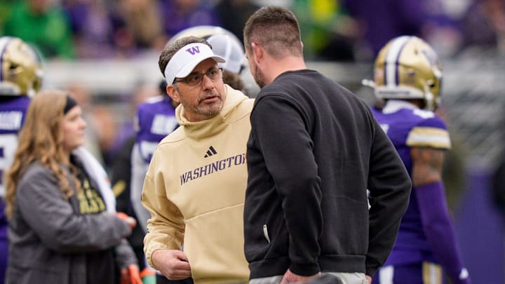 Washington head coach Jedd Fisch, left, and Oregon head coach Dan Lanning talk before the game as the Oregon Ducks take on the Washington Huskies on Nov. 29, 2025, at Husky Stadium in Seattle, Washington.