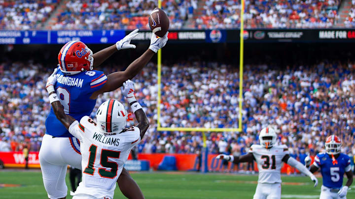 Florida Gators tight end Arlis Boardingham (8) can’t hold onto a pass while being defended by Miami Hurricanes defensive back Markeith Williams (15) during the season opener at Ben Hill Griffin Stadium in Gainesville, FL on Saturday, August 31, 2024 against the University of Miami Hurricanes in the first half. [Doug Engle/Gainesville Sun]