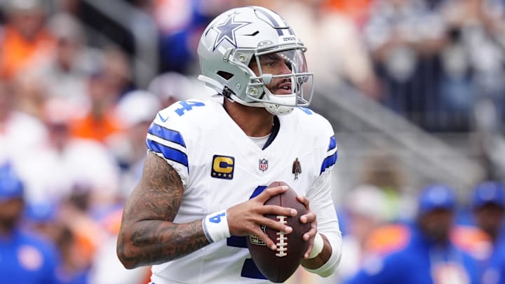 Dallas Cowboys quarterback Dak Prescott (4) looks to throw against the Denver Broncos in the first half at Empower Field at Mile High. Dallas Cowboys quarterback Dak Prescott (4) looks to throw against the Denver Broncos in the first half at Empower Field at Mile High.