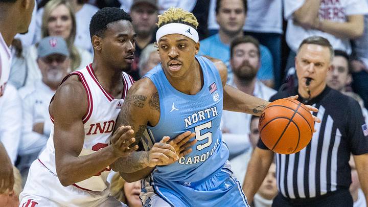 Nov 30, 2022; Bloomington, Indiana, USA; North Carolina Tar Heels forward Armando Bacot (5) dribblesIndiana Hoosiers forward Jordan Geronimo (22) the ball while defends in the first half at Simon Skjodt Assembly Hall. Mandatory Credit: Trevor Ruszkowski-Imagn Images Nov 30, 2022; Bloomington, Indiana, USA; North Carolina Tar Heels forward Armando Bacot (5) dribblesIndiana Hoosiers forward Jordan Geronimo (22) the ball while defends in the first half at Simon Skjodt Assembly Hall. Mandatory Credit: Trevor Ruszkowski-Imagn Images