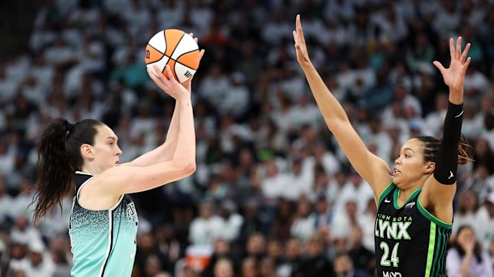 Oct 16, 2024; Minneapolis, Minnesota, USA; New York Liberty forward Breanna Stewart (30) shoots as Minnesota Lynx forward Napheesa Collier (24) defends during the second half of game three of the 2024 WNBA Finals at Target Center. Mandatory Credit: Matt Krohn-Imagn Images