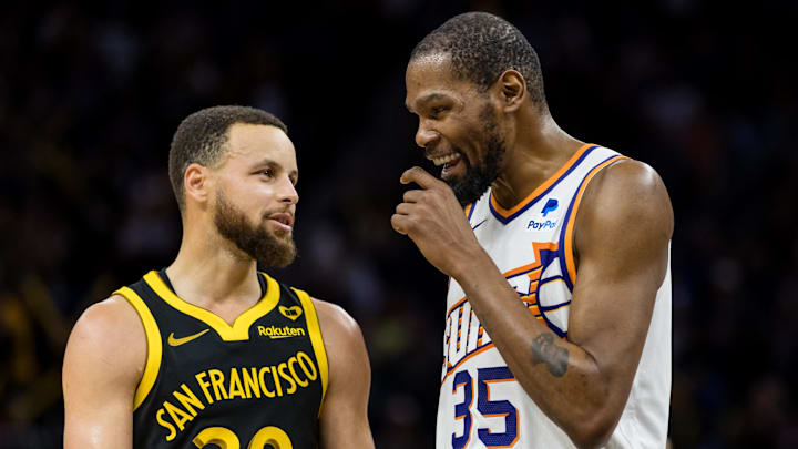 Feb 10, 2024; San Francisco, California, USA; Golden State Warriors guard Stephen Curry (30) and Phoenix Suns forward Kevin Durant (35) talk during the second half at Chase Center. Mandatory Credit: John Hefti-Imagn Images