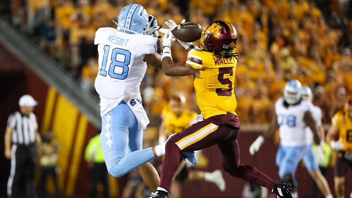 Aug 29, 2024; Minneapolis, Minnesota, USA; Minnesota Golden Gophers defensive back Justin Walley (5) intercepts a pass intended for North Carolina Tar Heels tight end Bryson Nesbit (18) during the first half at Huntington Bank Stadium. Mandatory Credit: Matt Krohn-Imagn Images