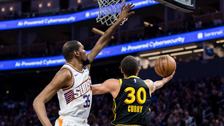 Phoenix Suns forward Kevin Durant (35) defends against Golden State Warriors guard Stephen Curry (30) during the second half at Chase Center. Mandatory Credit: John Hefti-Imagn Images Phoenix Suns forward Kevin Durant (35) defends against Golden State Warriors guard Stephen Curry (30) during the second half at Chase Center. Mandatory Credit: John Hefti-Imagn Images