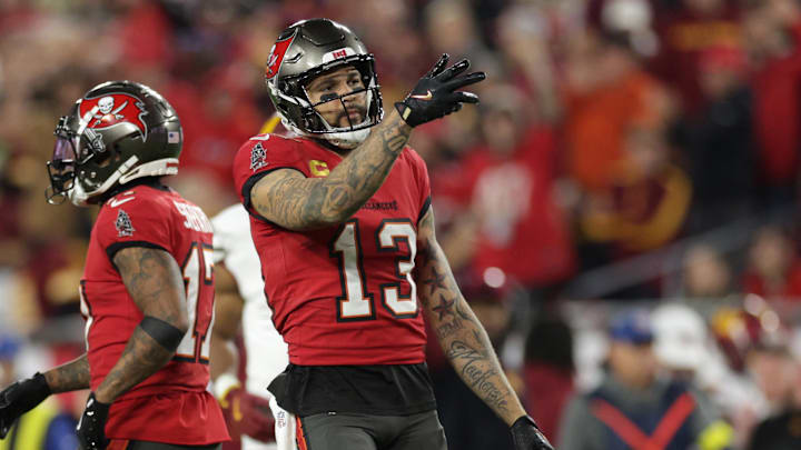 Jan 12, 2025; Tampa, Florida, USA; Tampa Bay Buccaneers wide receiver Mike Evans (13) reacts after a first down during the third quarter of a NFC wild card playoff against the Washington Commanders at Raymond James Stadium. Mandatory Credit: Nathan Ray Seebeck-Imagn Images Jan 12, 2025; Tampa, Florida, USA; Tampa Bay Buccaneers wide receiver Mike Evans (13) reacts after a first down during the third quarter of a NFC wild card playoff against the Washington Commanders at Raymond James Stadium. Mandatory Credit: Nathan Ray Seebeck-Imagn Images