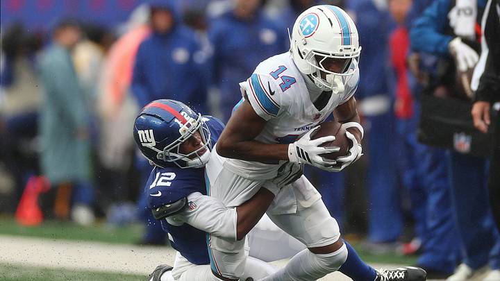 Sep 27, 2026; East Rutherford, New Jersey, USA; New York Giants cornerback Colton Hood (12) tackles Tennessee Titans wide receiver Carnell Tate (14) during the fourth quarter at MetLife Stadium. Mandatory Credit: Vincent Carchietta-Imagn Images Sep 27, 2026; East Rutherford, New Jersey, USA; New York Giants cornerback Colton Hood (12) tackles Tennessee Titans wide receiver Carnell Tate (14) during the fourth quarter at MetLife Stadium. Mandatory Credit: Vincent Carchietta-Imagn Images