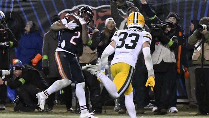 Jan 10, 2026; Chicago, IL, USA;  Chicago Bears wide receiver DJ Moore (2) makes the eventual game winning touchdown catch as Green Bay Packers safety Evan Williams (33) defends  during the second half of an NFC Wild Card Round game at Soldier Field. Mandatory Credit: Matt Marton-Imagn Images