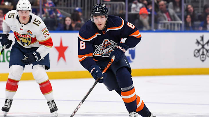 Dec 23, 2022; Elmont, New York, USA; New York Islanders defenseman Noah Dobson (8) skates across