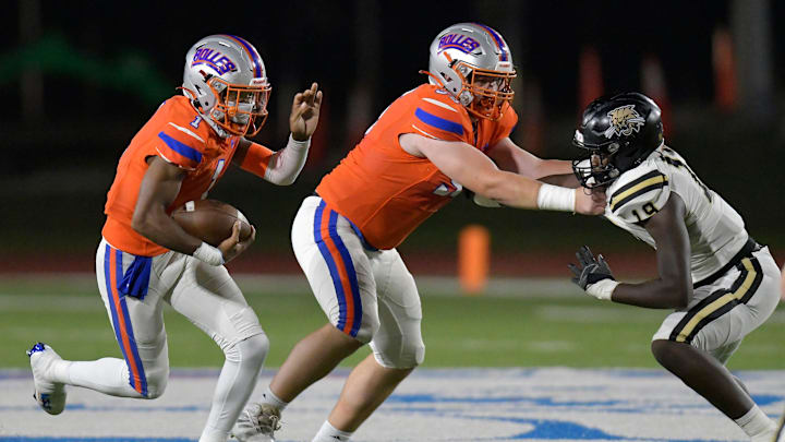 Bolles Bulldogs' JJ Sparks (55) holds off Buchholz's Jamaryn Reese (19) to give Bolles Bulldogs' DJ Moore (1) running room during first quarter action. The Buchholz Bobcats traveled from Gainesville to play The Bolles School Bulldogs at Skinner-Barco Stadium in Jacksonville, FL Friday November 4, 2022.

Jki 110422 Buchholz At Bolles Hsfb 06