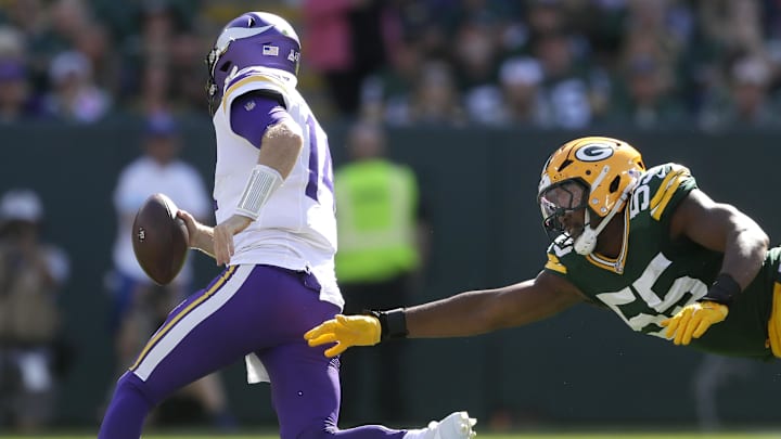 Sep 29, 2024; Green Bay, Wisconsin, USA; Green Bay Packers defensive end Kingsley Enagbare (55) chases Minnesota Vikings quarterback Sam Darnold (14) during their football game on Sunday, September 29, 2024 at Lambeau Field in Green Bay, Wis. The Vikings defeated the Packers 31-29. Sep 29, 2024; Green Bay, Wisconsin, USA; Green Bay Packers defensive end Kingsley Enagbare (55) chases Minnesota Vikings quarterback Sam Darnold (14) during their football game on Sunday, September 29, 2024 at Lambeau Field in Green Bay, Wis. The Vikings defeated the Packers 31-29.