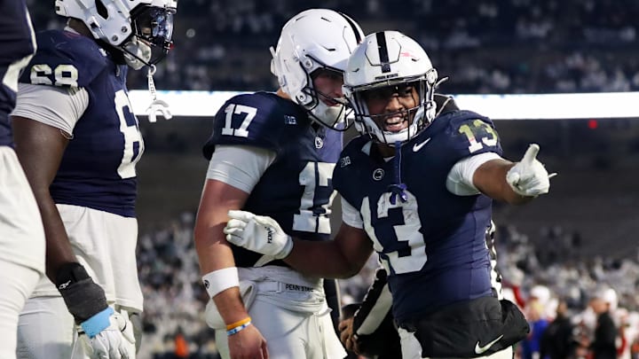 Penn State Nittany Lions running back Kaytron Allen (13) celebrates with quarterback Ethan Grunkemeyer (17) after scoring a touchdown during the fourth quarter against the Nebraska Cornhuskers at Beaver Stadium. 