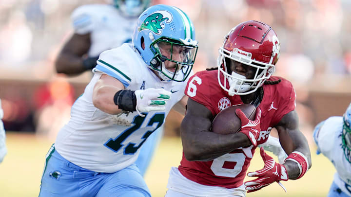 Oklahoma Sooners wide receiver Deion Burks (6) runs past Tulane Green Wave linebacker Tyler Grubbs (13) during a college football game between the University of Oklahoma Sooners (OU) and the Tulane Green Wave at Gaylord Family - Oklahoma Memorial Stadium in Norman, Okla., Saturday, Sept. 14, 2024. Oklahoma Sooners wide receiver Deion Burks (6) runs past Tulane Green Wave linebacker Tyler Grubbs (13) during a college football game between the University of Oklahoma Sooners (OU) and the Tulane Green Wave at Gaylord Family - Oklahoma Memorial Stadium in Norman, Okla., Saturday, Sept. 14, 2024.