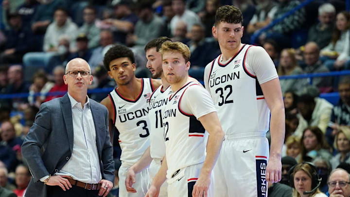 Nov 11, 2023; Hartford, Connecticut, USA; UConn Huskies head coach Dan Hurley talks with forward Jaylin Stewart (3), forward Alex Karaban (11), center Donovan Clingan (32) and guard Cam Spencer (12) from the sideline as they take on the Stonehill Skyhawks at XL Center. Mandatory Credit: David Butler II-Imagn Images Nov 11, 2023; Hartford, Connecticut, USA; UConn Huskies head coach Dan Hurley talks with forward Jaylin Stewart (3), forward Alex Karaban (11), center Donovan Clingan (32) and guard Cam Spencer (12) from the sideline as they take on the Stonehill Skyhawks at XL Center. Mandatory Credit: David Butler II-Imagn Images