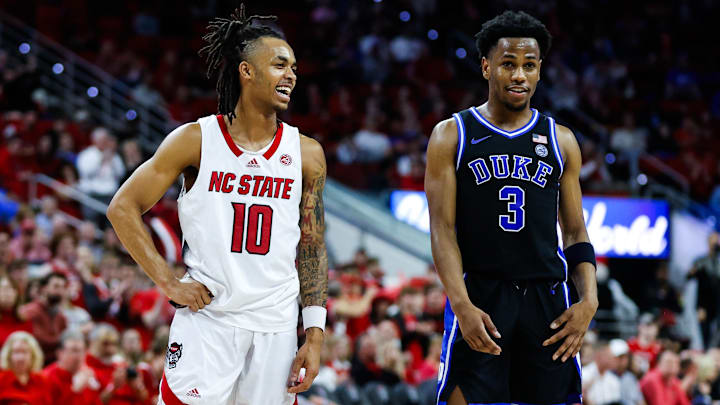 Mar 4, 2024; Raleigh, North Carolina, USA; North Carolina State Wolfpack guard Breon Pass (10) and Duke Blue Devils guard Jeremy Roach (3)