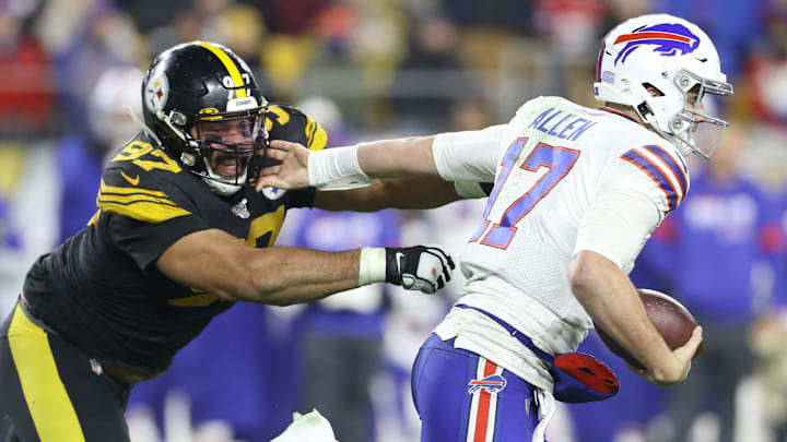 Dec 15, 2019; Pittsburgh, PA, USA;   Buffalo Bills quarterback Josh Allen (17) runs the ball against Pittsburgh Steelers defensive end Cameron Heyward (97) during the third quarter at Heinz Field.