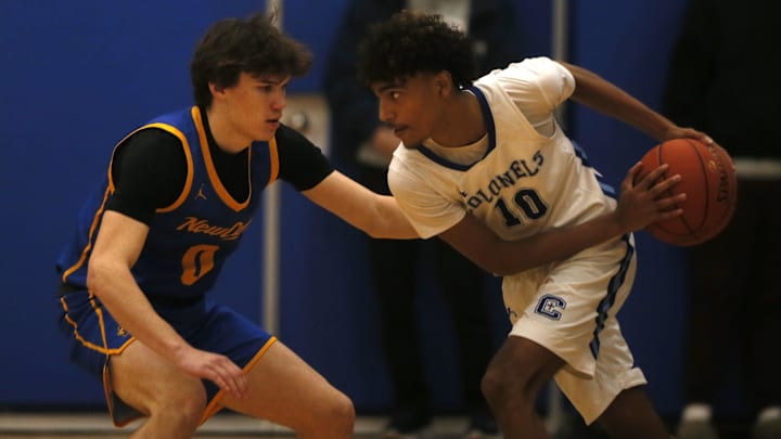 NCC's Johnny Luhn (0) guards CovCath's Braeden Myrick (10) as Covington Catholic defeated Newport Central Catholic 78-35 in boys basketball Jan. 3, 2026 at CovCath.