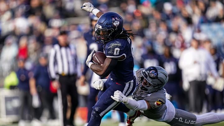 UConn Huskies running back Cam Edwards runs the ball against the Air Force Falcons. UConn Huskies running back Cam Edwards runs the ball against the Air Force Falcons.