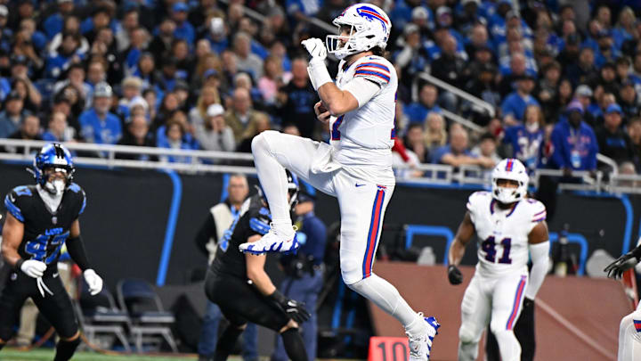 Dec 15, 2024; Detroit, Michigan, USA; Buffalo Bills quarterback Josh Allen (17) leaps across the goal line for his second touchdown