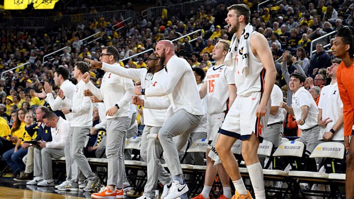 Mar 2, 2025; Ann Arbor, Michigan, USA; The Illinois Fighting Illini bench reacts to a guard made three point shot against the Michigan Wolverines in the second half at Crisler Center. Mandatory Credit: Lon Horwedel-Imagn Images