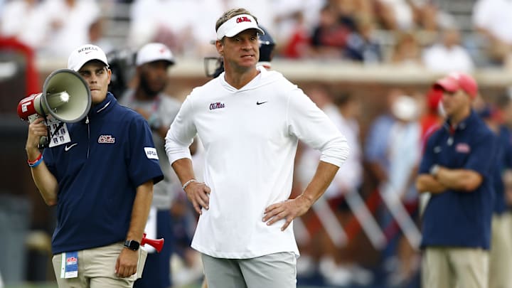 Aug 31, 2024; Oxford, Mississippi, USA; Mississippi Rebels head coach Lane Kiffin watches during warm ups prior to the game against the Furman Paladins at Vaught-Hemingway Stadium. Mandatory Credit: Petre Thomas-Imagn Images Aug 31, 2024; Oxford, Mississippi, USA; Mississippi Rebels head coach Lane Kiffin watches during warm ups prior to the game against the Furman Paladins at Vaught-Hemingway Stadium. Mandatory Credit: Petre Thomas-Imagn Images