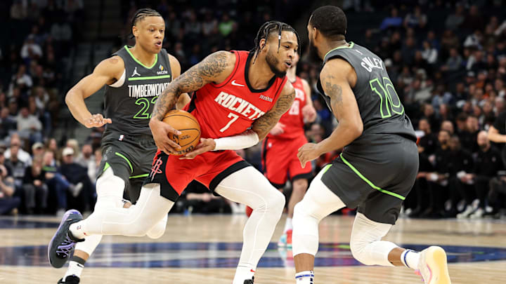 Houston Rockets forward Cam Whitmore drives towards the basket as Minnesota Timberwolves guard Mike Conley (10) and guard Jaylen Clark defend during the second quarter at Target Center in Minneapolis on Feb. 6, 2025.